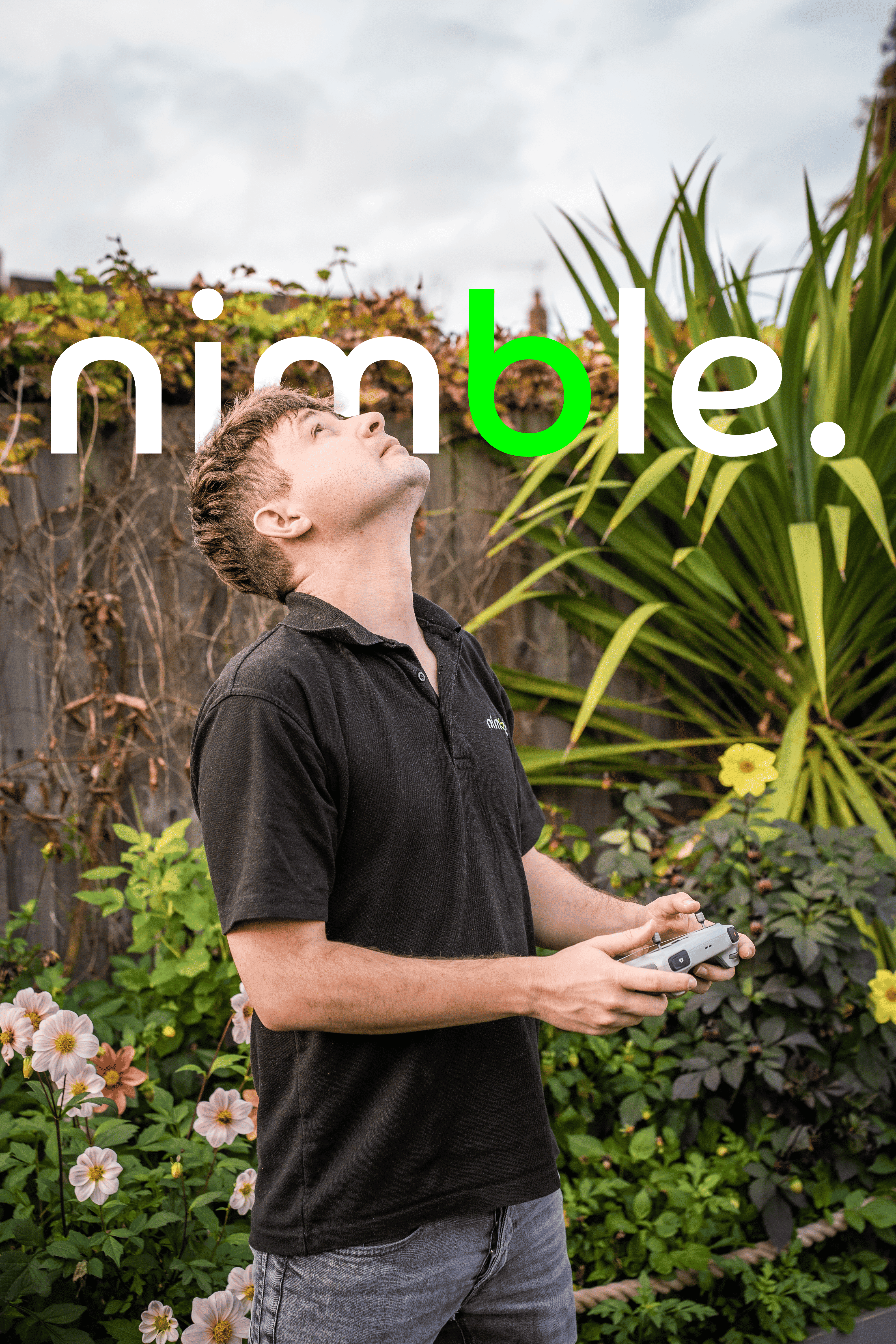 Ben flying his drone wiht the Nimble Logo in the background