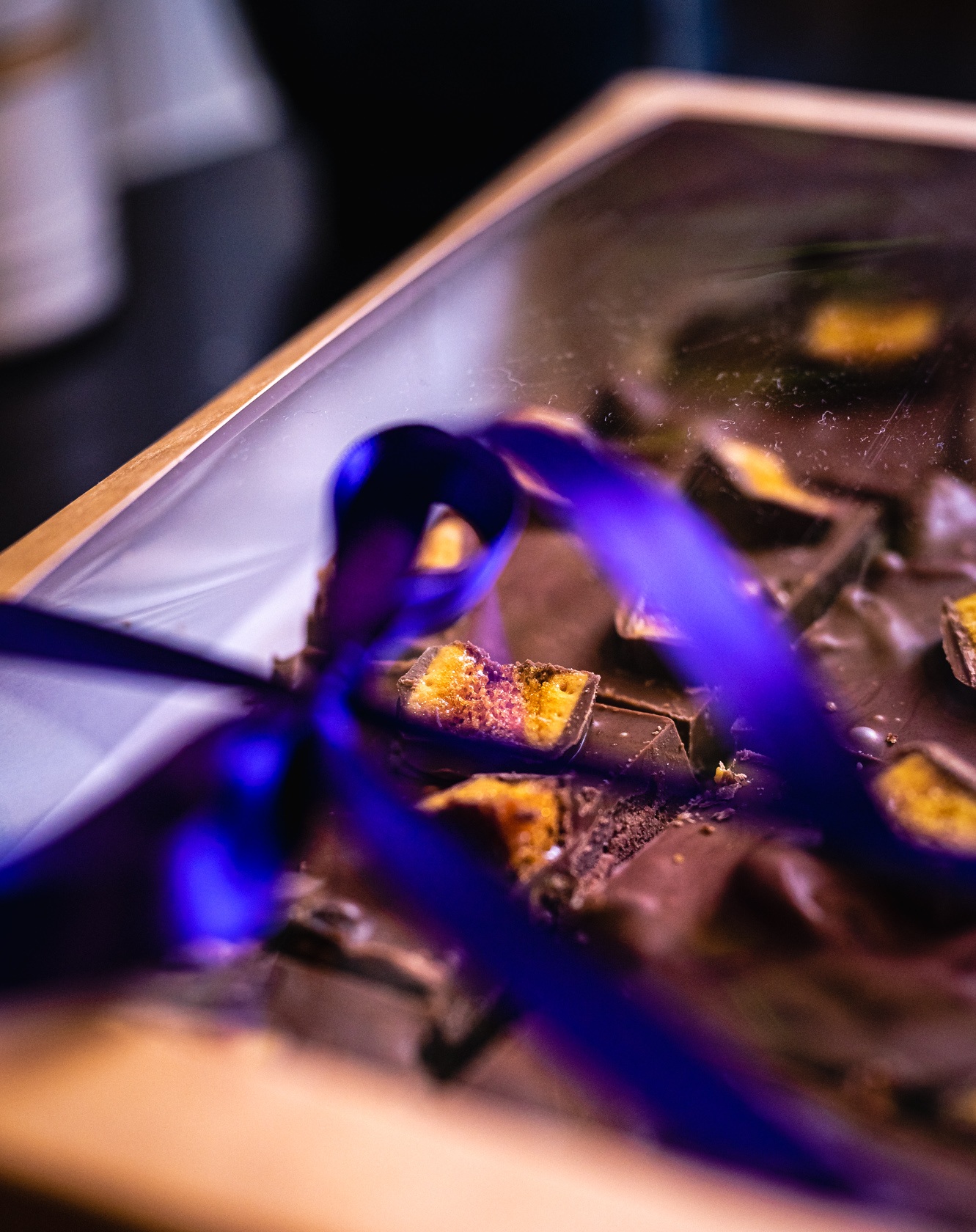 Close-up of colourful wedding chocolates and ribbon, cropped to remove an old corner watermark